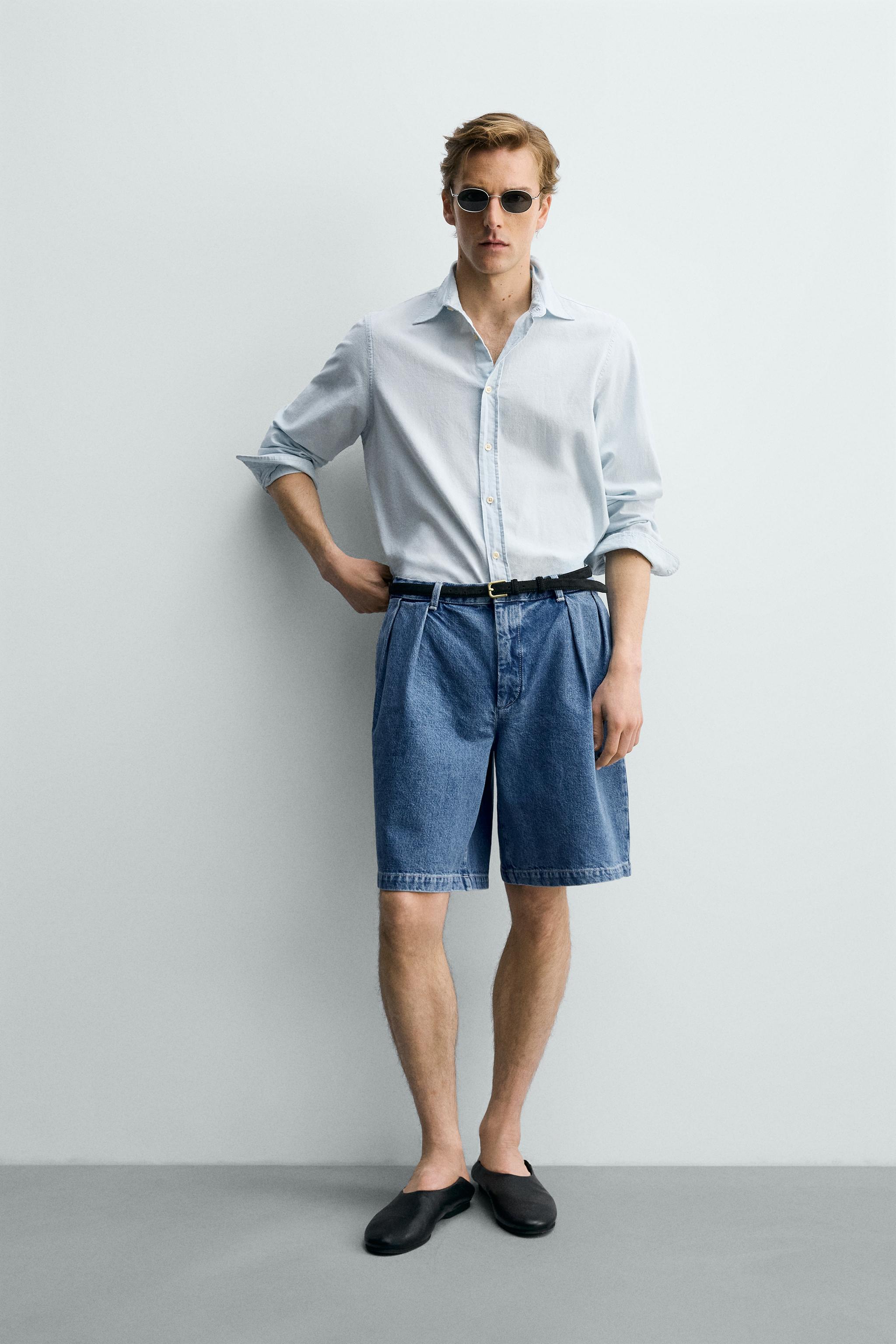 RELAXED FIT PLEATED DENIM SHORTS